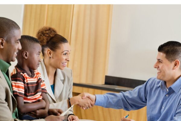 Parent shaking a teachers hand
